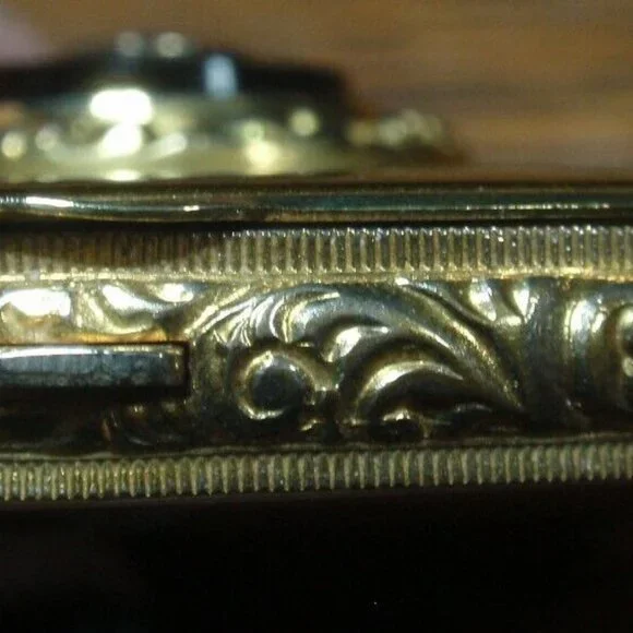 Gold Guild Compact with Sterling and Onyx Emblem.
